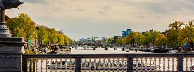 City Tour guiado por Amsterdam, incluindo todos os principais pontos turísticos, parada fotográfica em moinho de vento às margens do Amstel e visita a uma fábrica de diamantes!